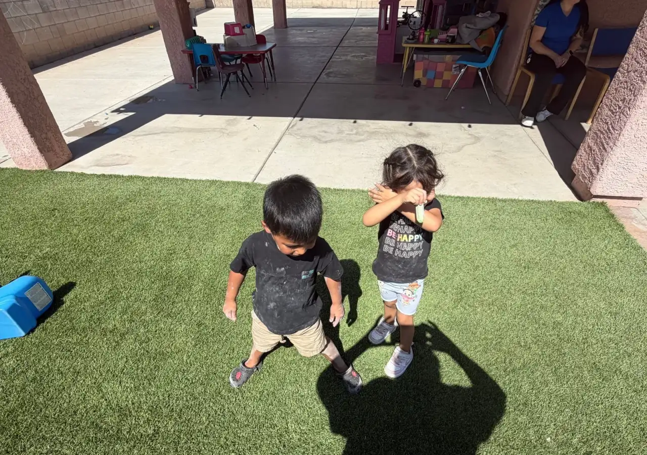 Children playing in the covered yard at Angelita's Little Angels, Tucson AZ