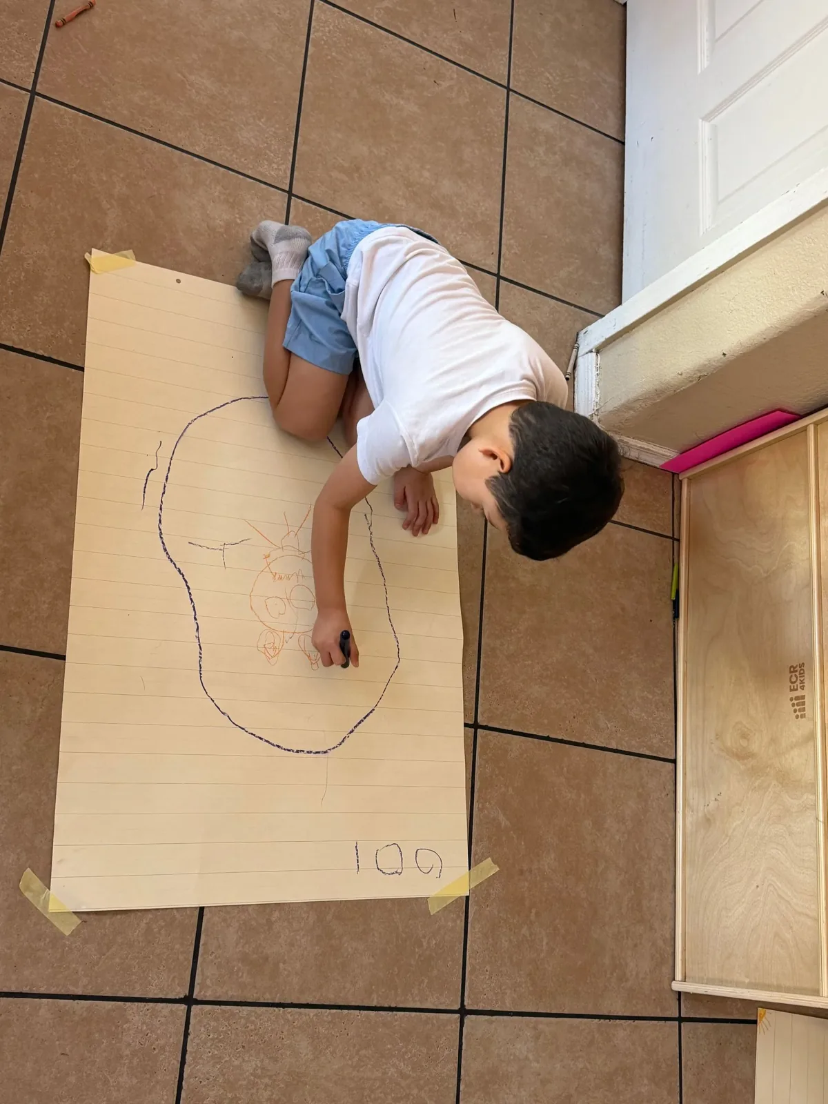 Drawing on big sheets of paper at Angelita's Little Angels, Tucson
